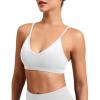 imageYEOREO Women V Neck Sports Bras Crisscross Adjustable Strappy Wirefree Padded Low Impact Yoga Gym Bra Workout Crop TopsWhite
